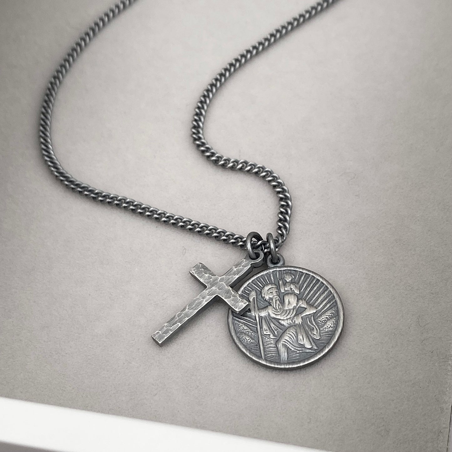 Oxidised or polished silver round Saint Christopher and hammered cross pendant and curb chain