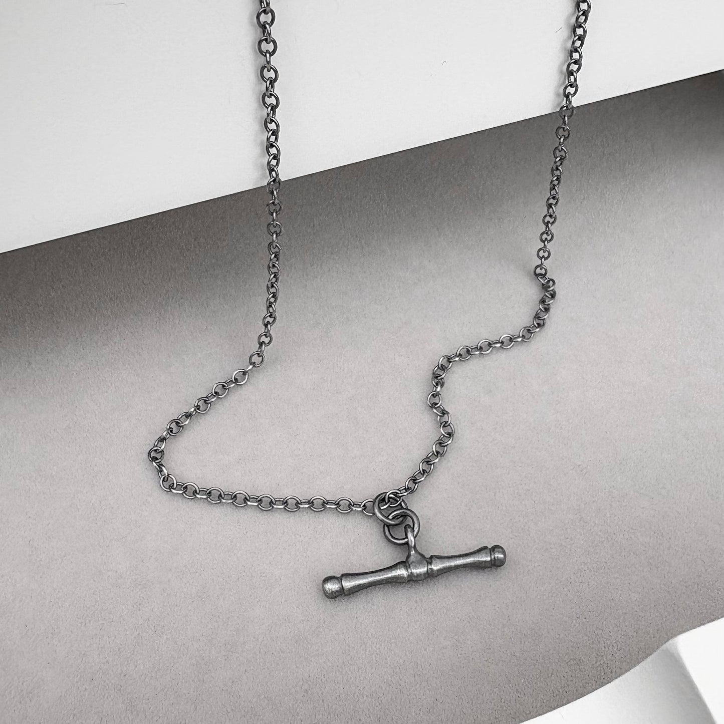 Oxidised or polished solid sterling silver T-bar pendant on a trace chain
