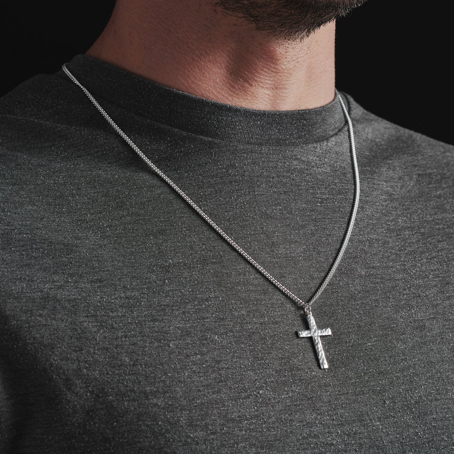 Polished sterling silver hammered finish small, standard, and medium cross pendants on a curb chain