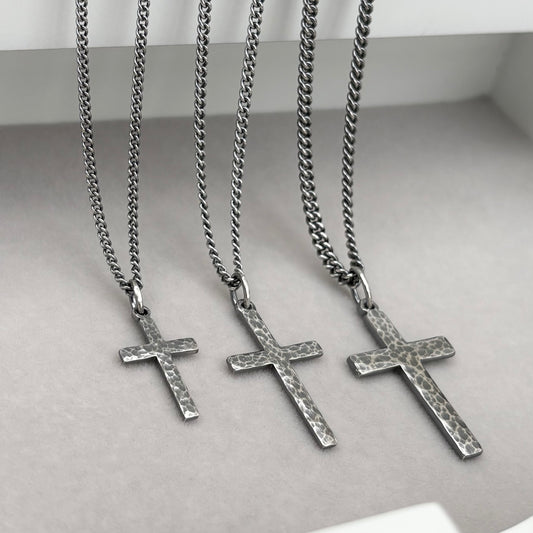 Antiqued sterling silver hammered finish small, standard, and medium cross pendants on a curb chain