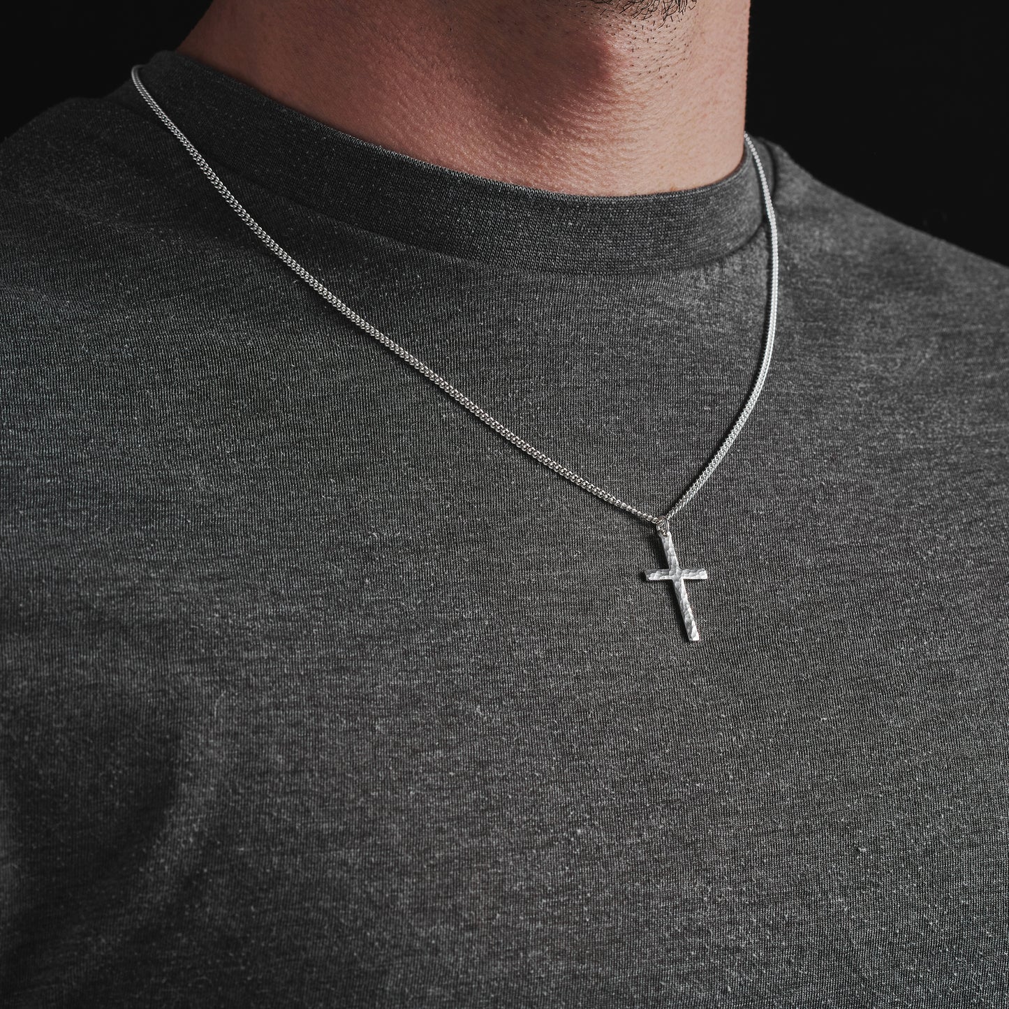 Polished sterling silver hammered finish small, standard, and medium cross pendants on a curb chain
