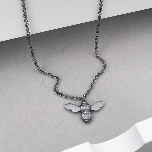 Oxidised solid sterling silver garden bumblebee pendant on a trace chain