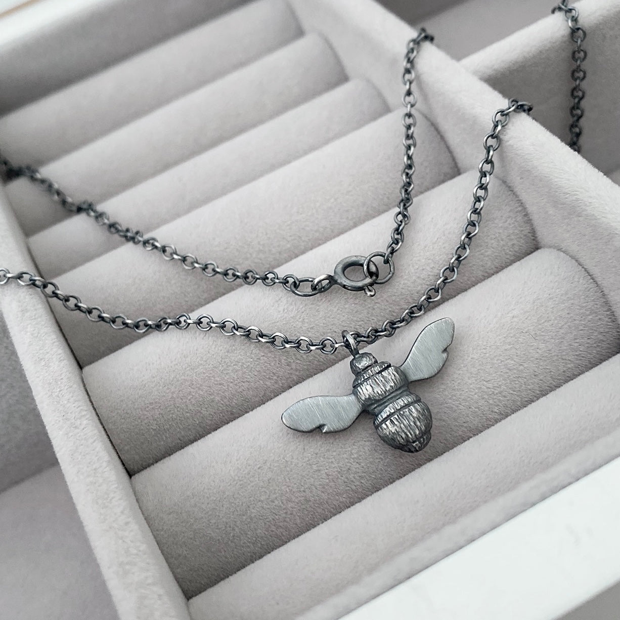 Oxidised solid sterling silver garden bumblebee pendant on a trace chain
