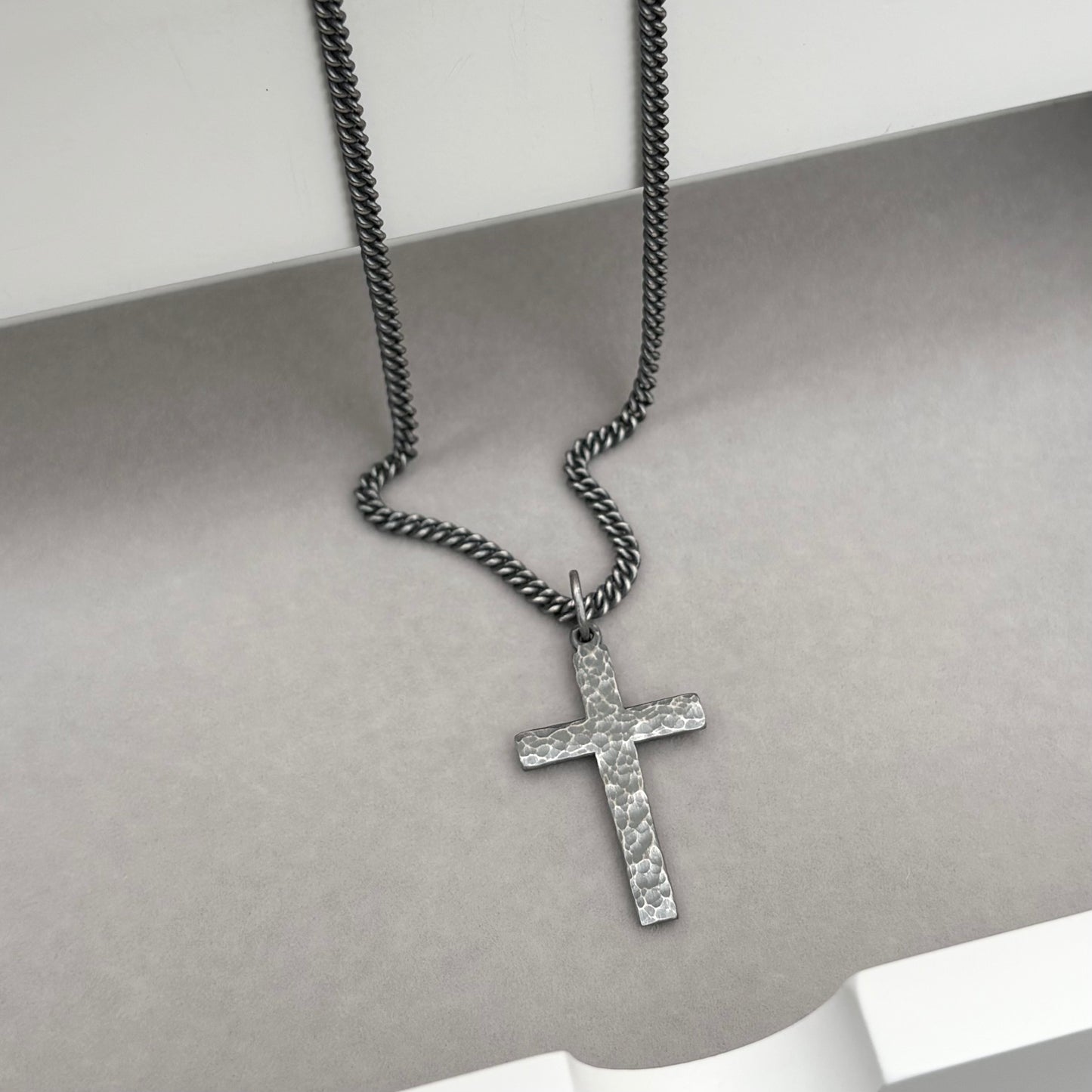 Oxidised or polished medium size sterling silver hammered cross pendant on a curb chain