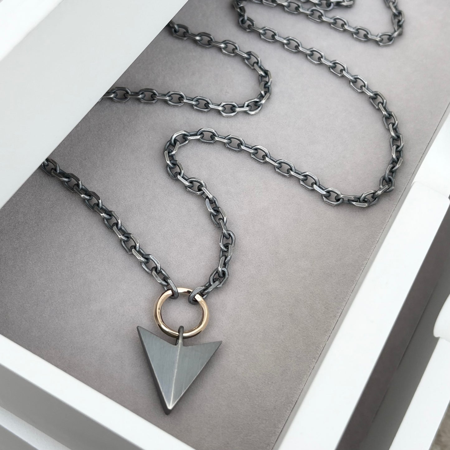 Oxidised or polished sterling silver large arrow and 9ct yellow gold loop pendant on a diamond cut trace chain