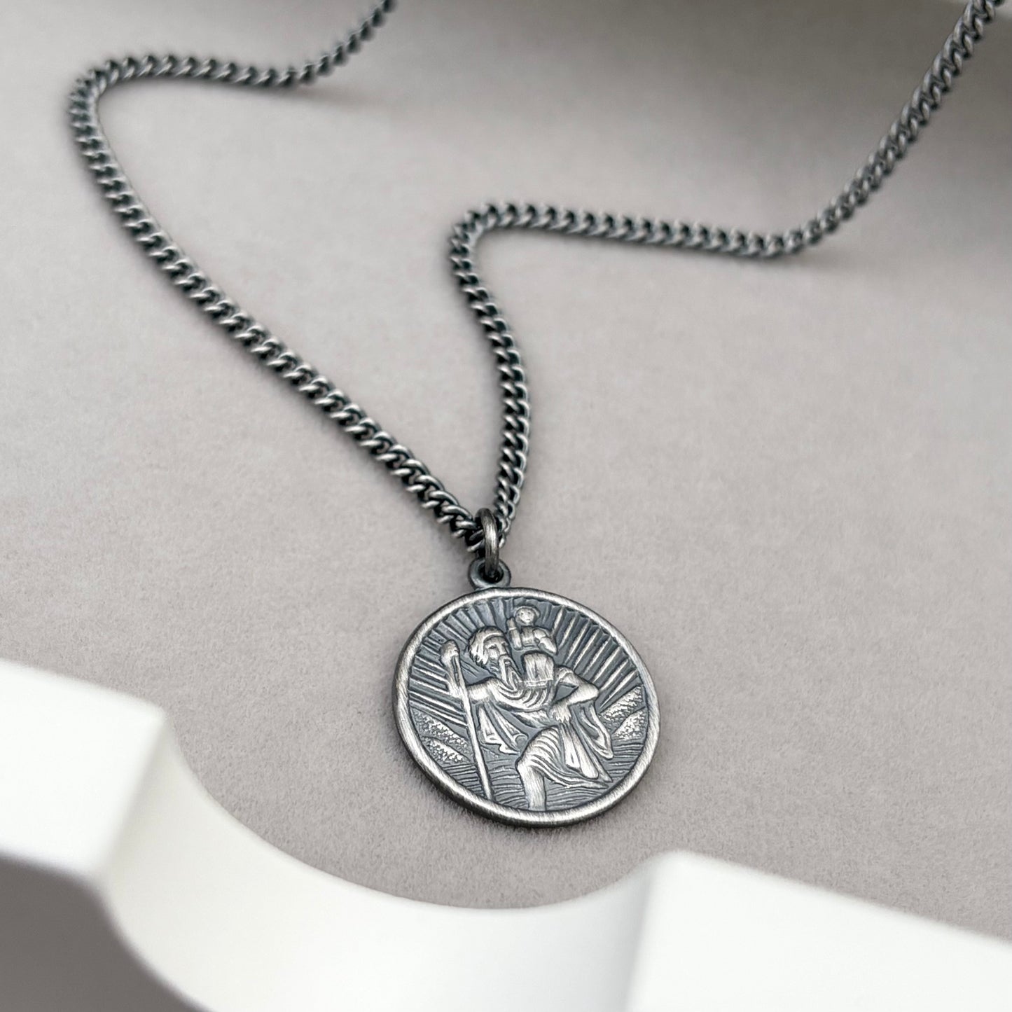 Oxidised or polished solid sterling silver round Saint Christopher pendant on a curb chain