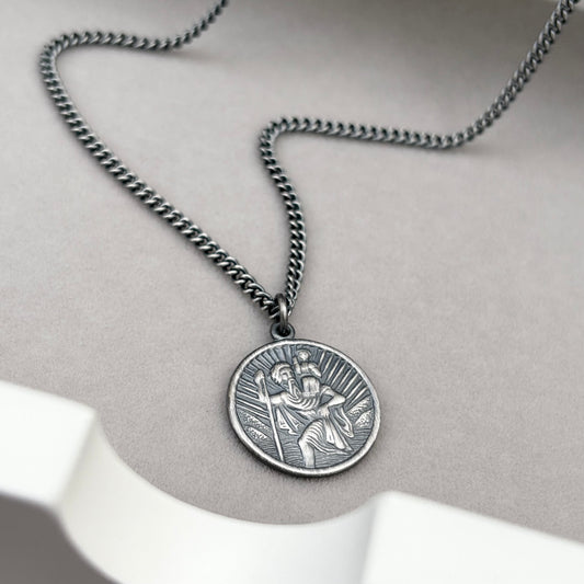 Oxidised or polished solid sterling silver round Saint Christopher pendant on a curb chain