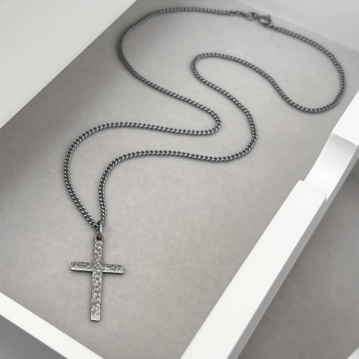 Oxidised or polished sterling silver standard size hammered cross pendant and on a curb chain