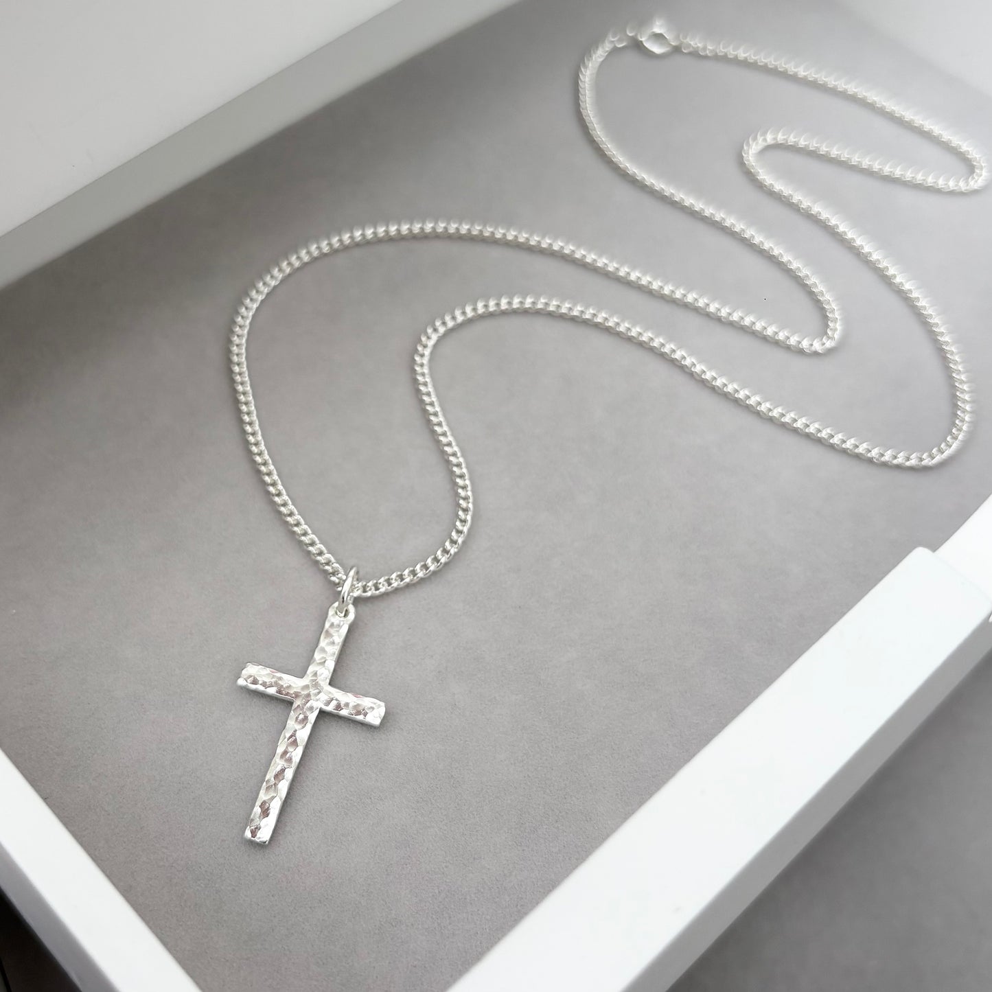 Oxidised or polished sterling silver standard size hammered cross pendant and on a curb chain