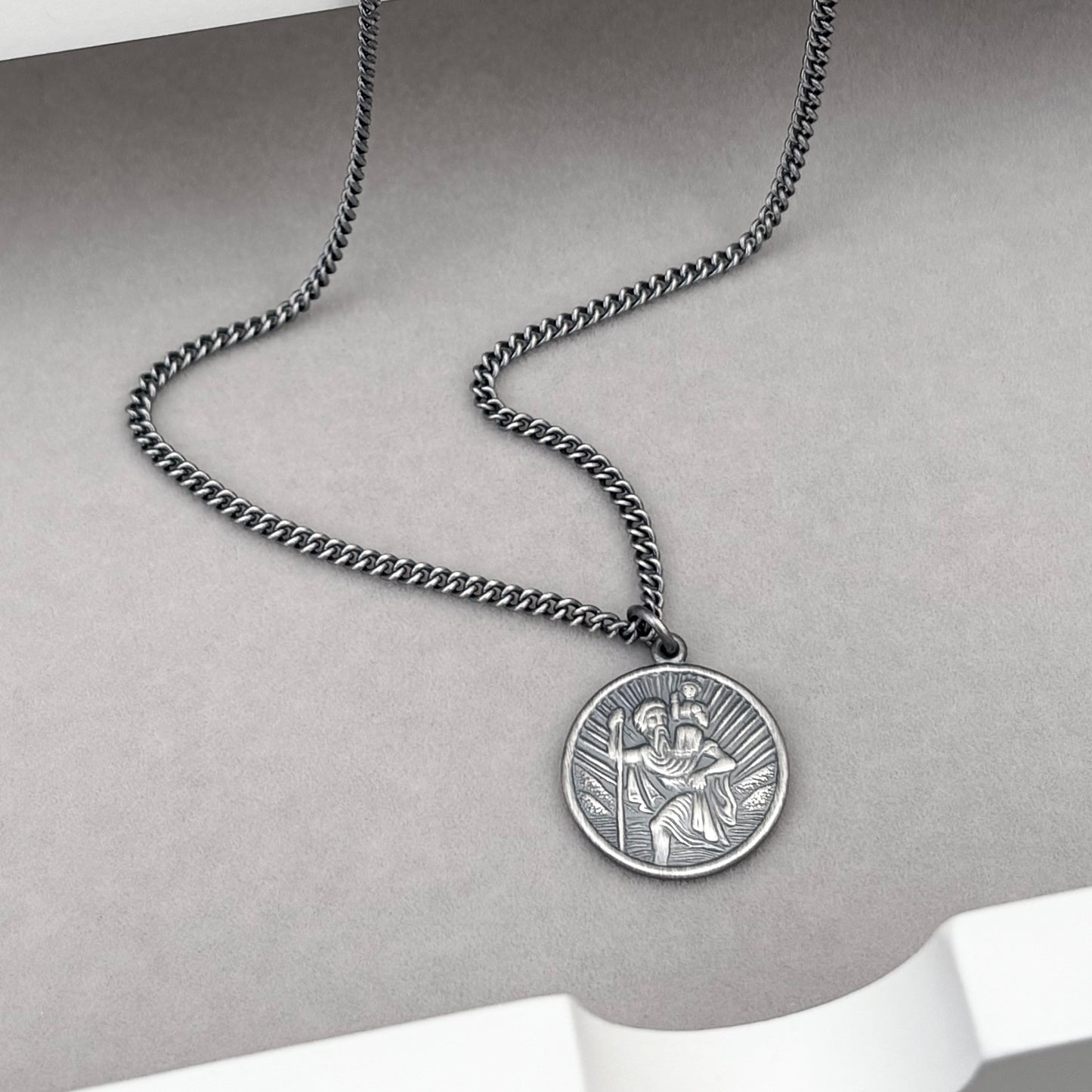 Oxidised or polished solid sterling silver round Saint Christopher pendant on a curb chain