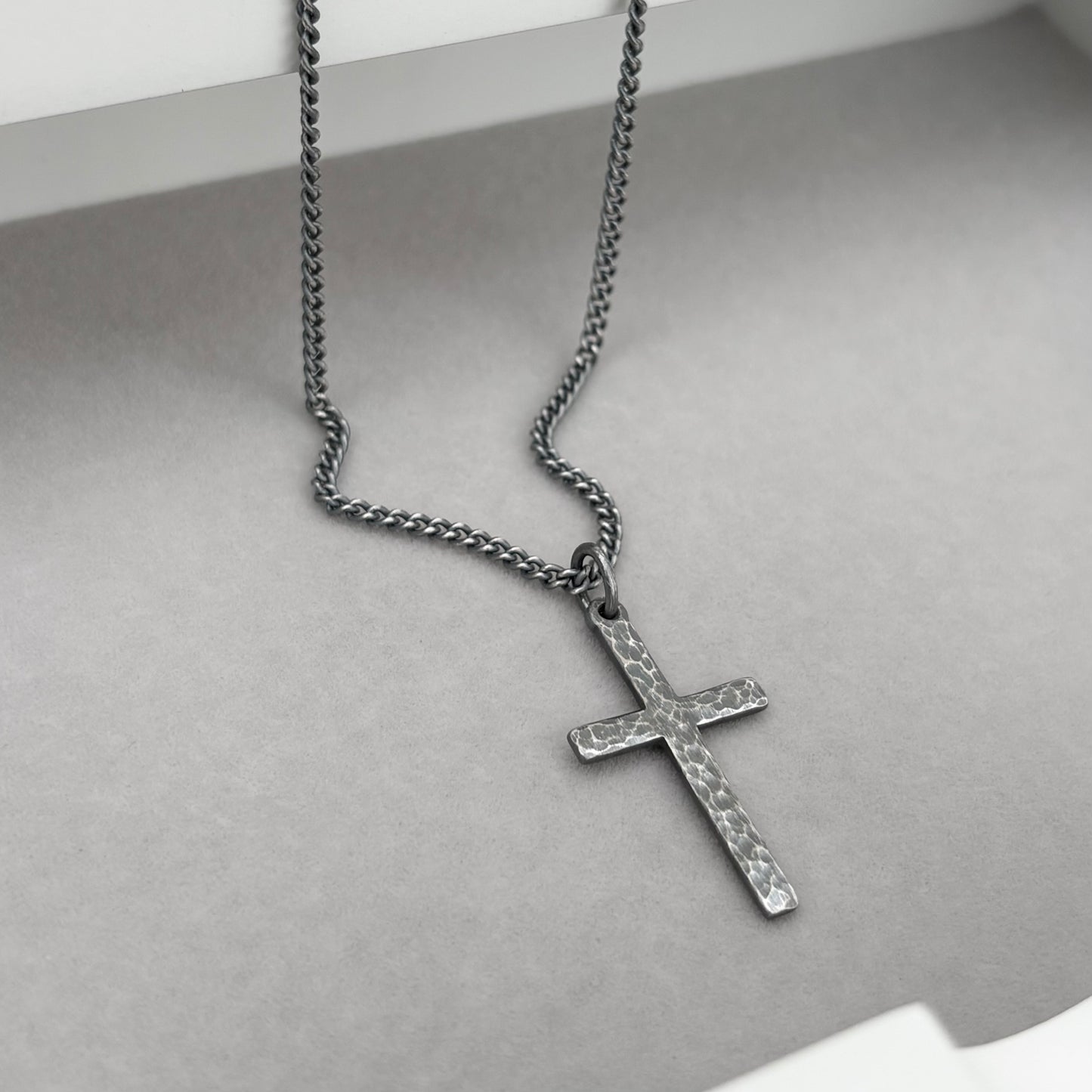 Oxidised or polished sterling silver standard size hammered cross pendant and on a curb chain