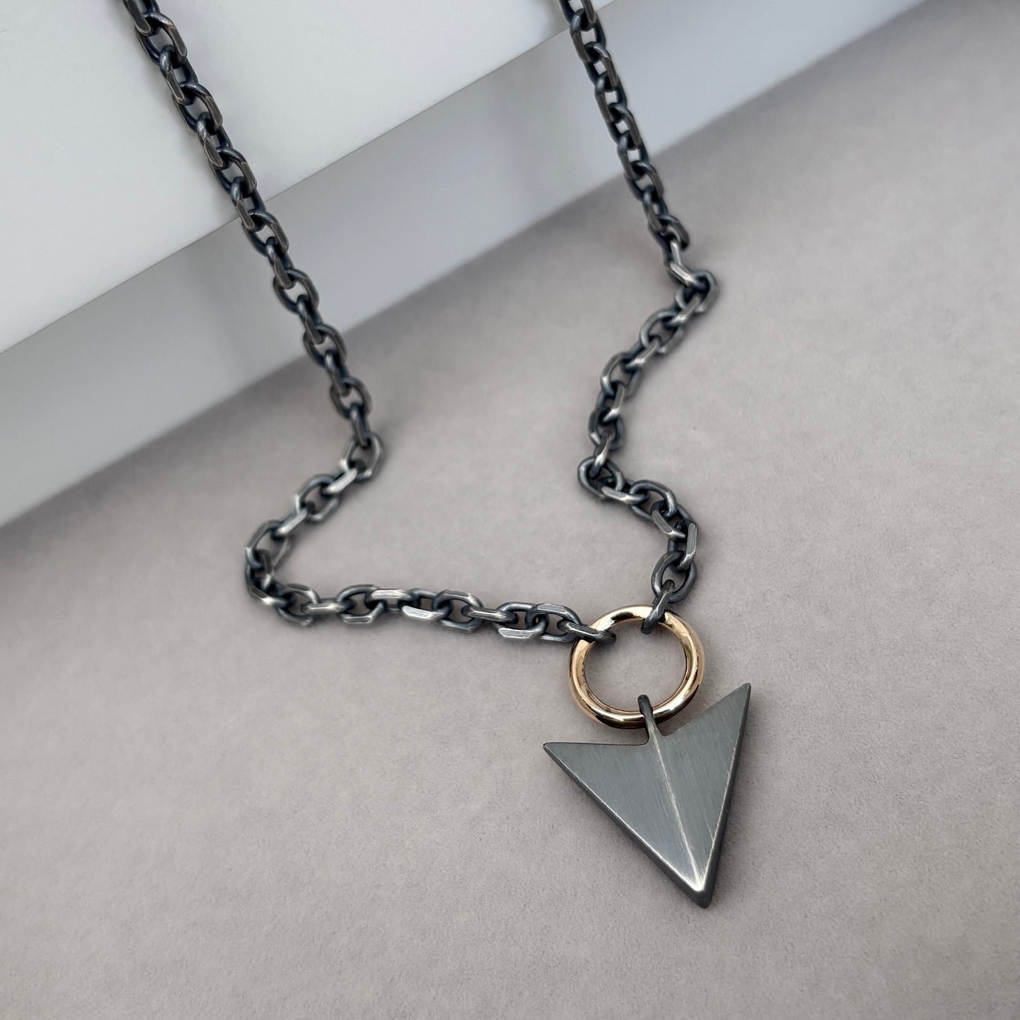 Oxidised or polished sterling silver large arrow and 9ct yellow gold loop pendant on a diamond cut trace chain