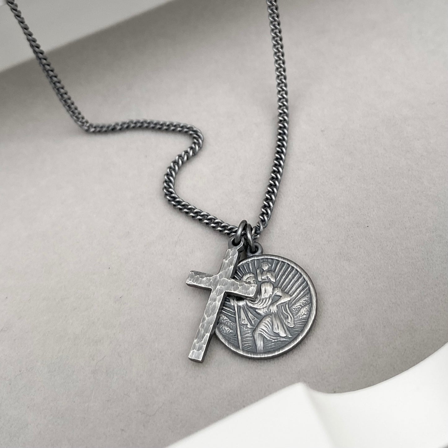 Oxidised or polished silver round Saint Christopher and hammered cross pendant and curb chain