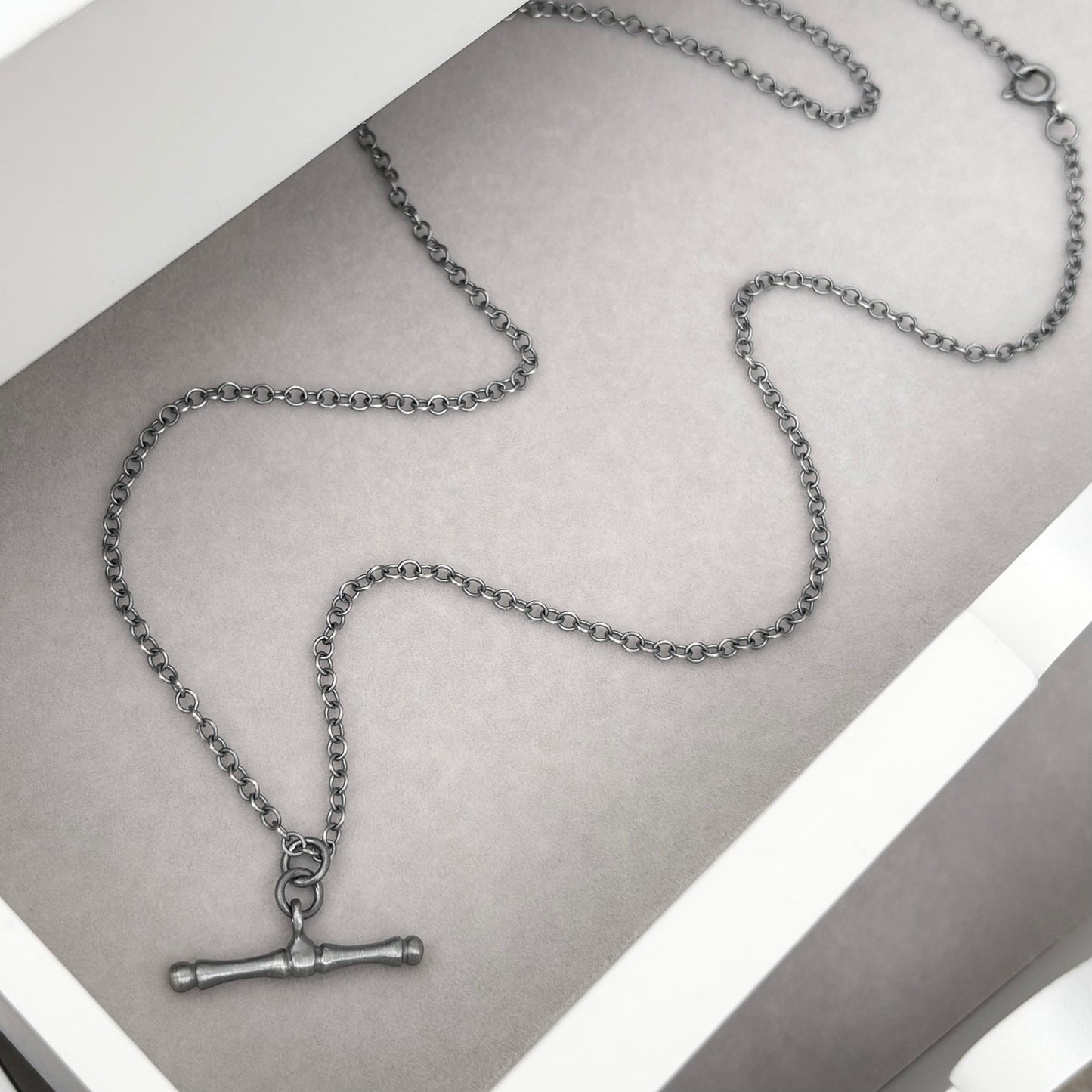 Oxidised or polished solid sterling silver T-bar pendant on a trace chain