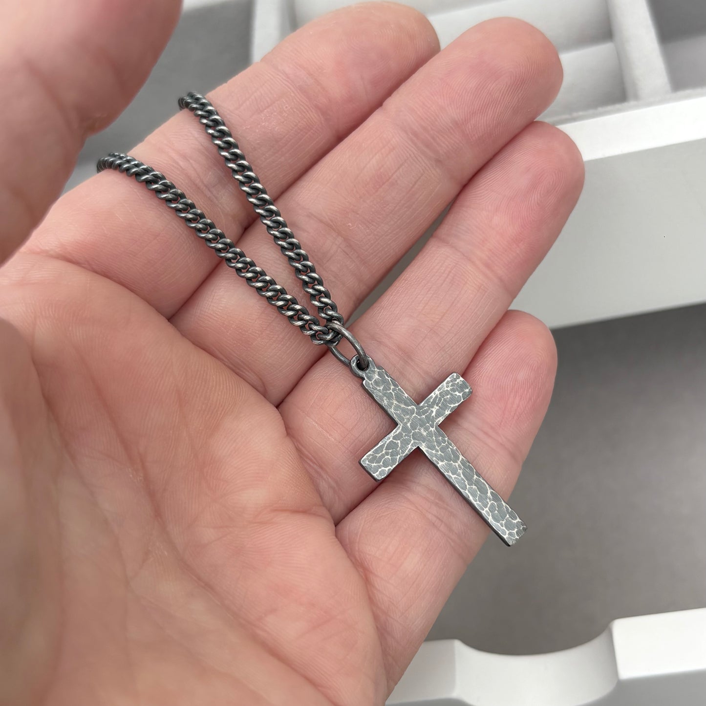 Oxidised or polished medium size sterling silver hammered cross pendant on a curb chain