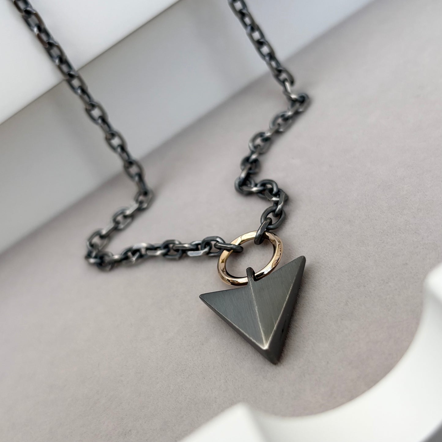 Oxidised or polished sterling silver large arrow and 9ct yellow gold loop pendant on a diamond cut trace chain