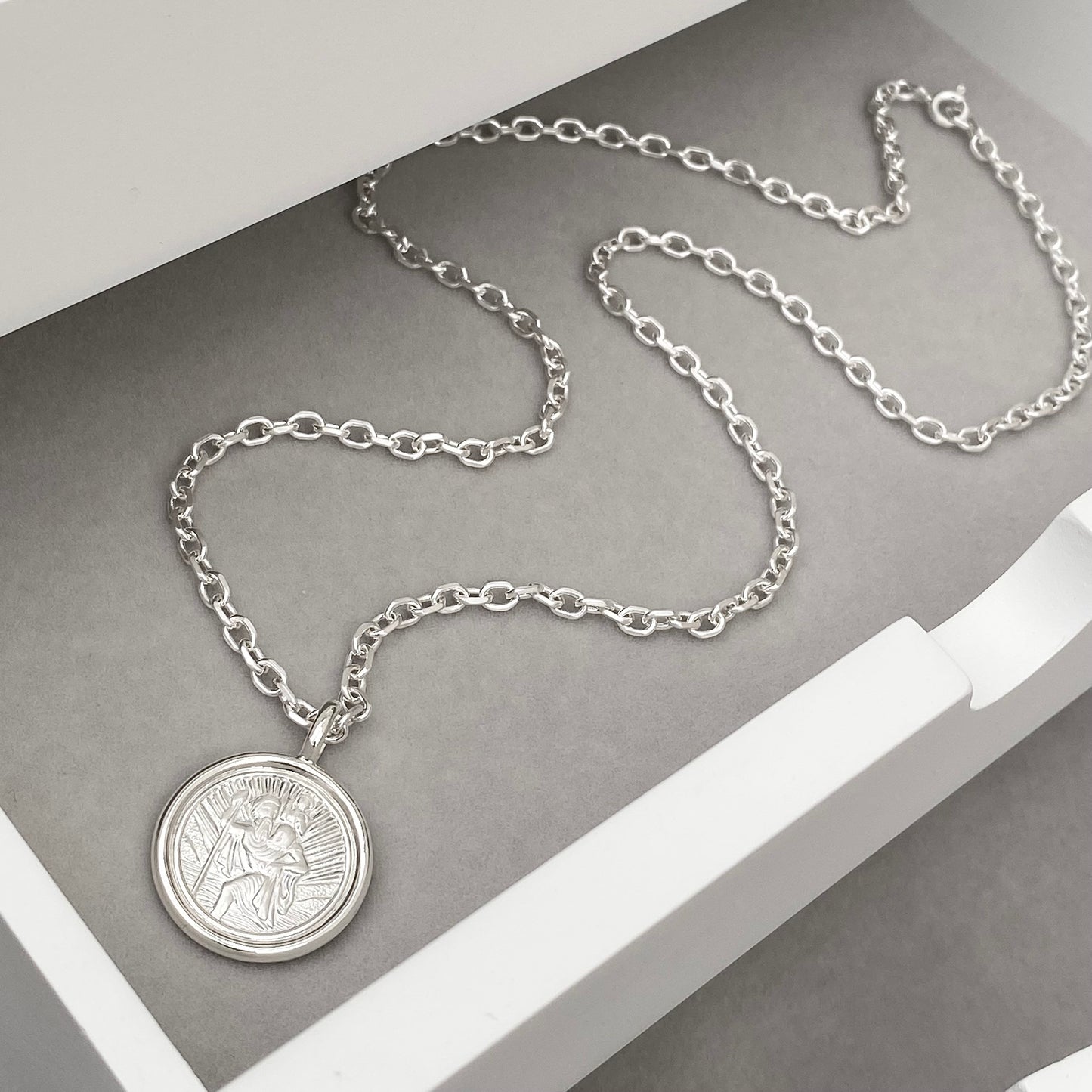 Oxidised solid silver Saint Christopher circle framed pendant on a 2.9mm wide diamond cut trace chain