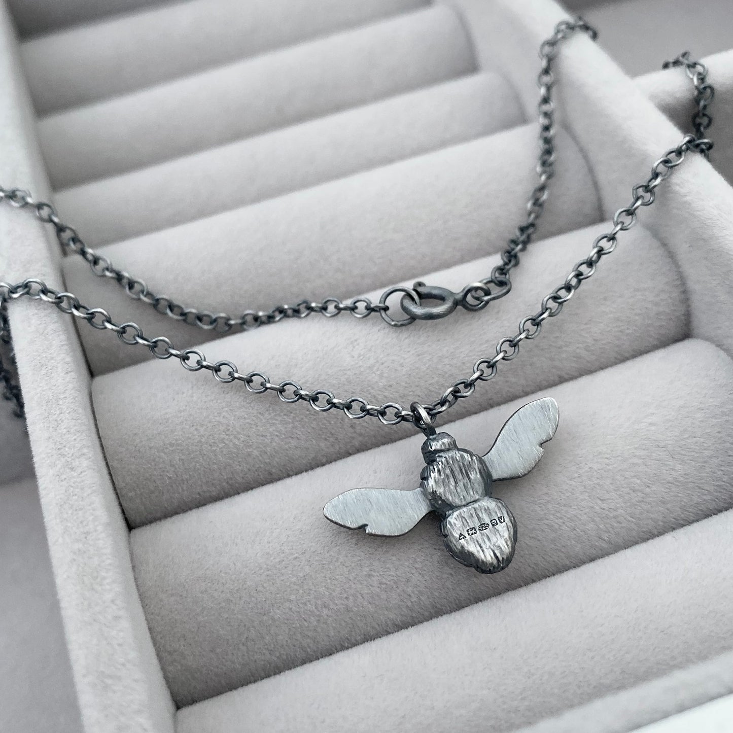 Oxidised solid sterling silver garden bumblebee pendant on a trace chain