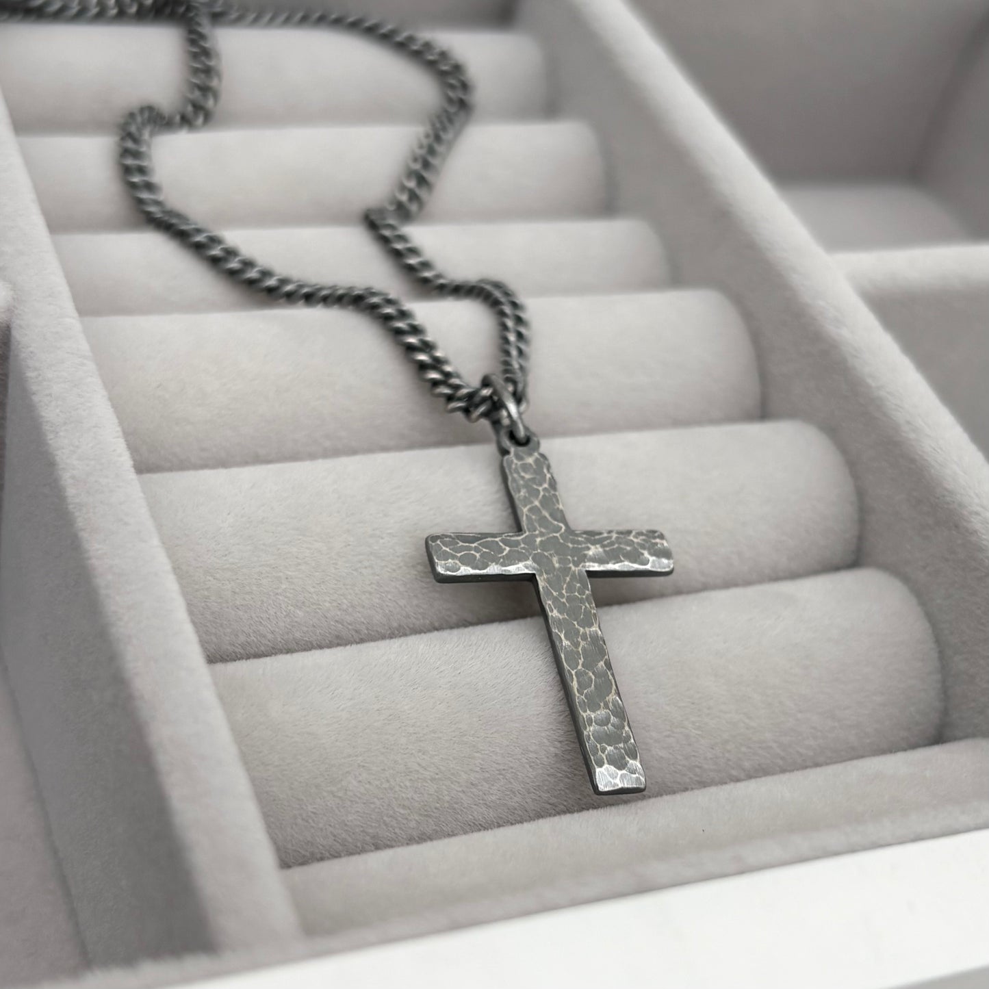 Oxidised or polished medium size sterling silver hammered cross pendant on a curb chain