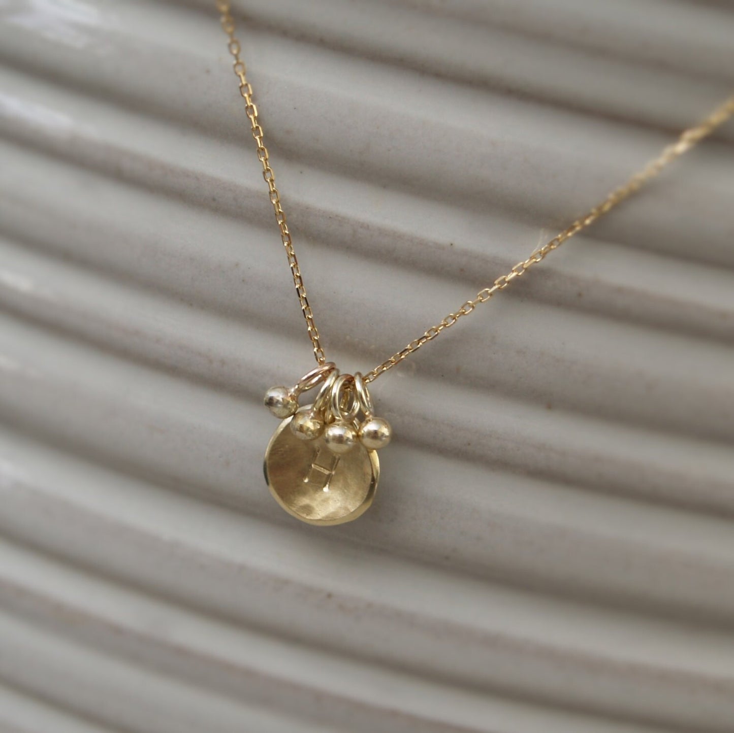Handmade 9ct solid yellow gold small 10mm petal charm pendant with seed ball detail on a chain - Can be personalised