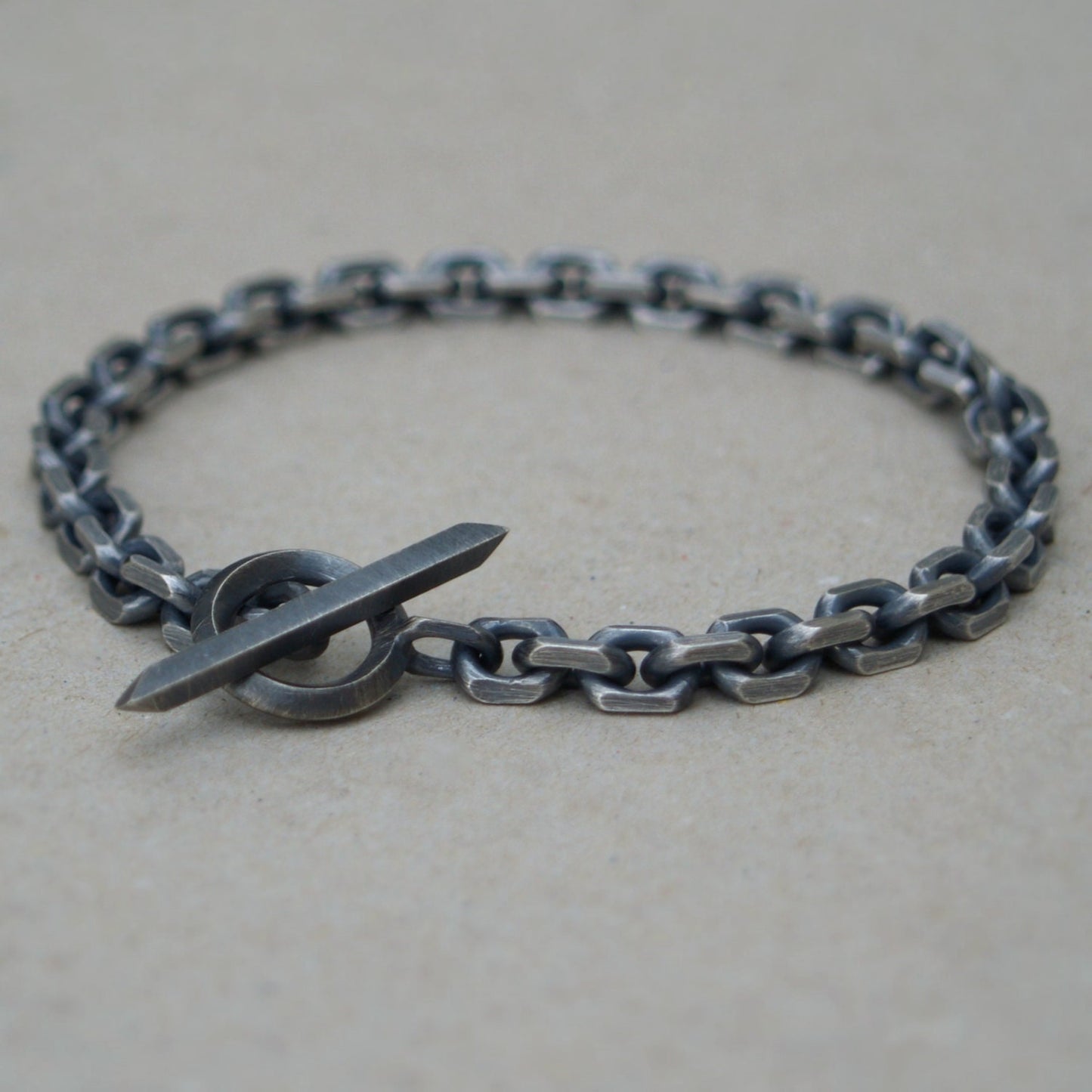 Oxidised or polished solid silver 6.6mm wide diamond cut trace chain bracelet with a unique T-bar design