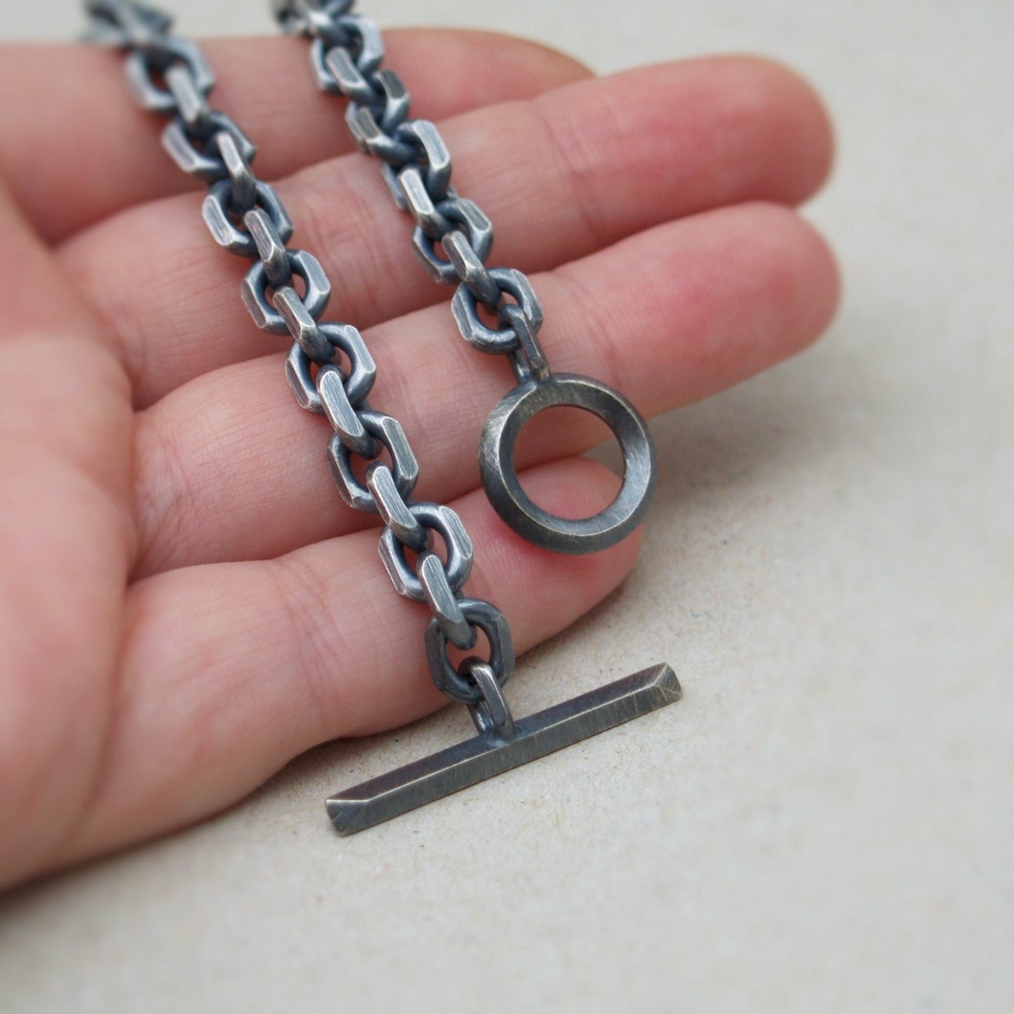 Oxidised or polished solid silver 6.6mm wide diamond cut trace chain bracelet with a unique T-bar design