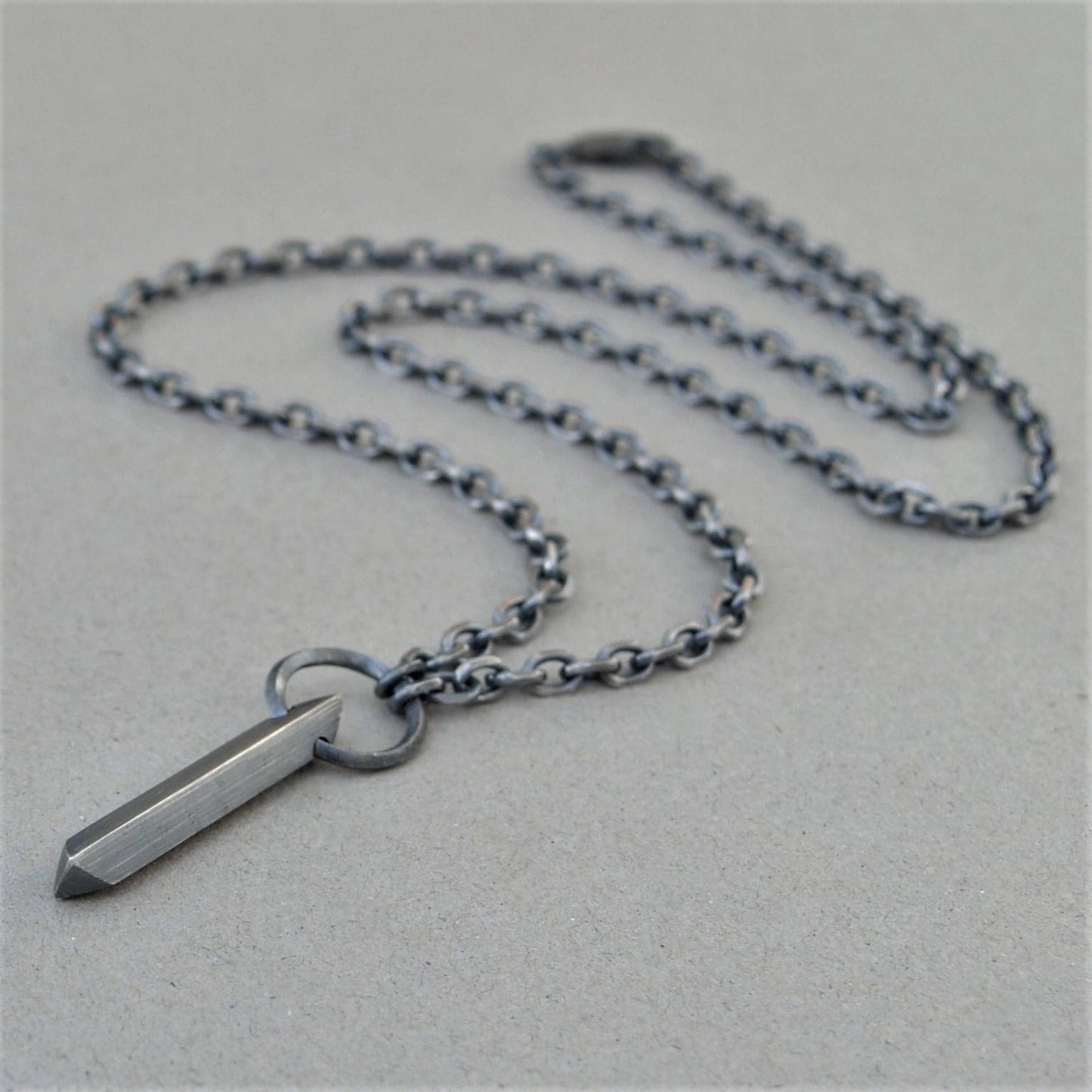 Oxidised or polished solid sterling silver large amulet pendant and loop detail on a diamond cut trace chain