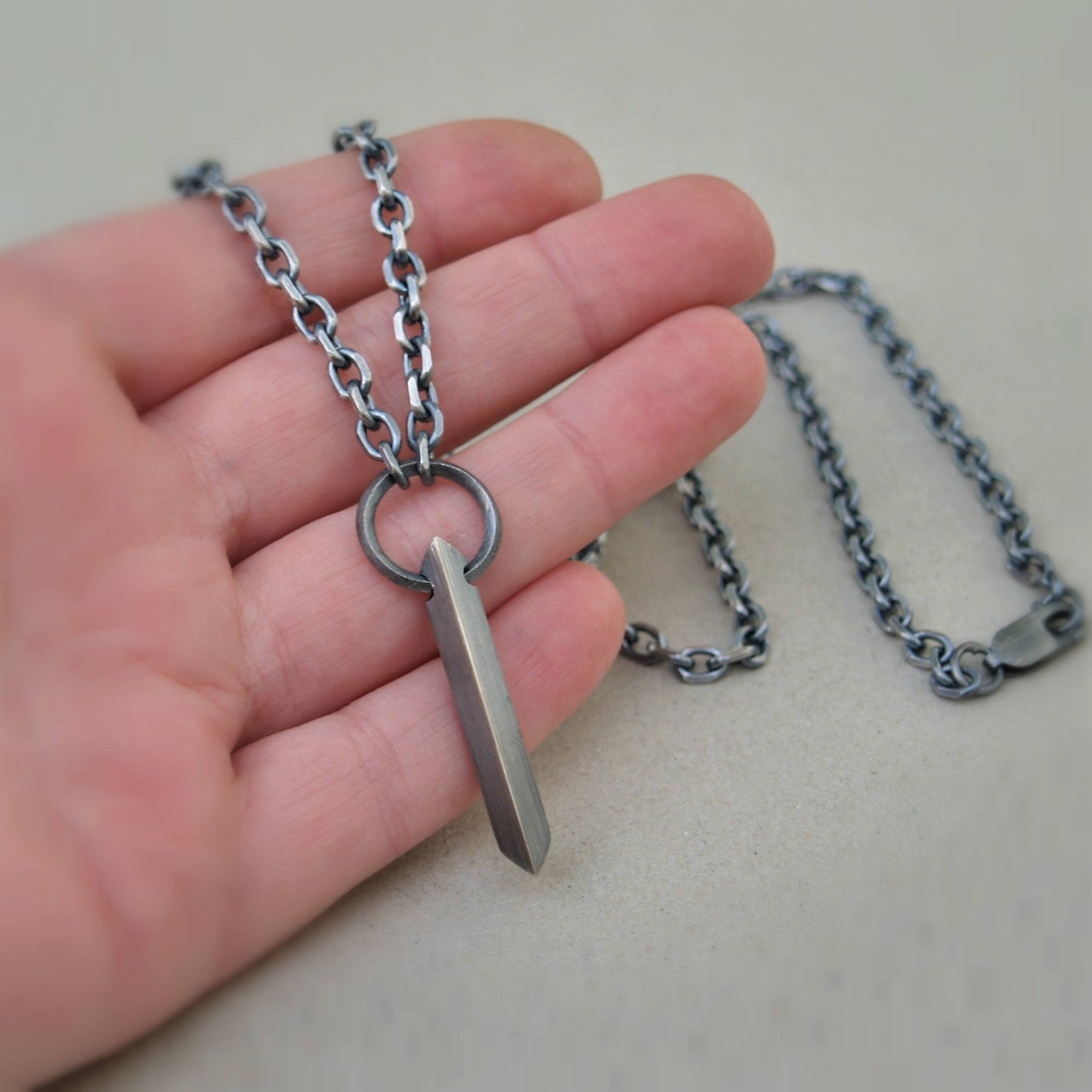 Oxidised or polished solid sterling silver large amulet pendant and loop detail on a diamond cut trace chain