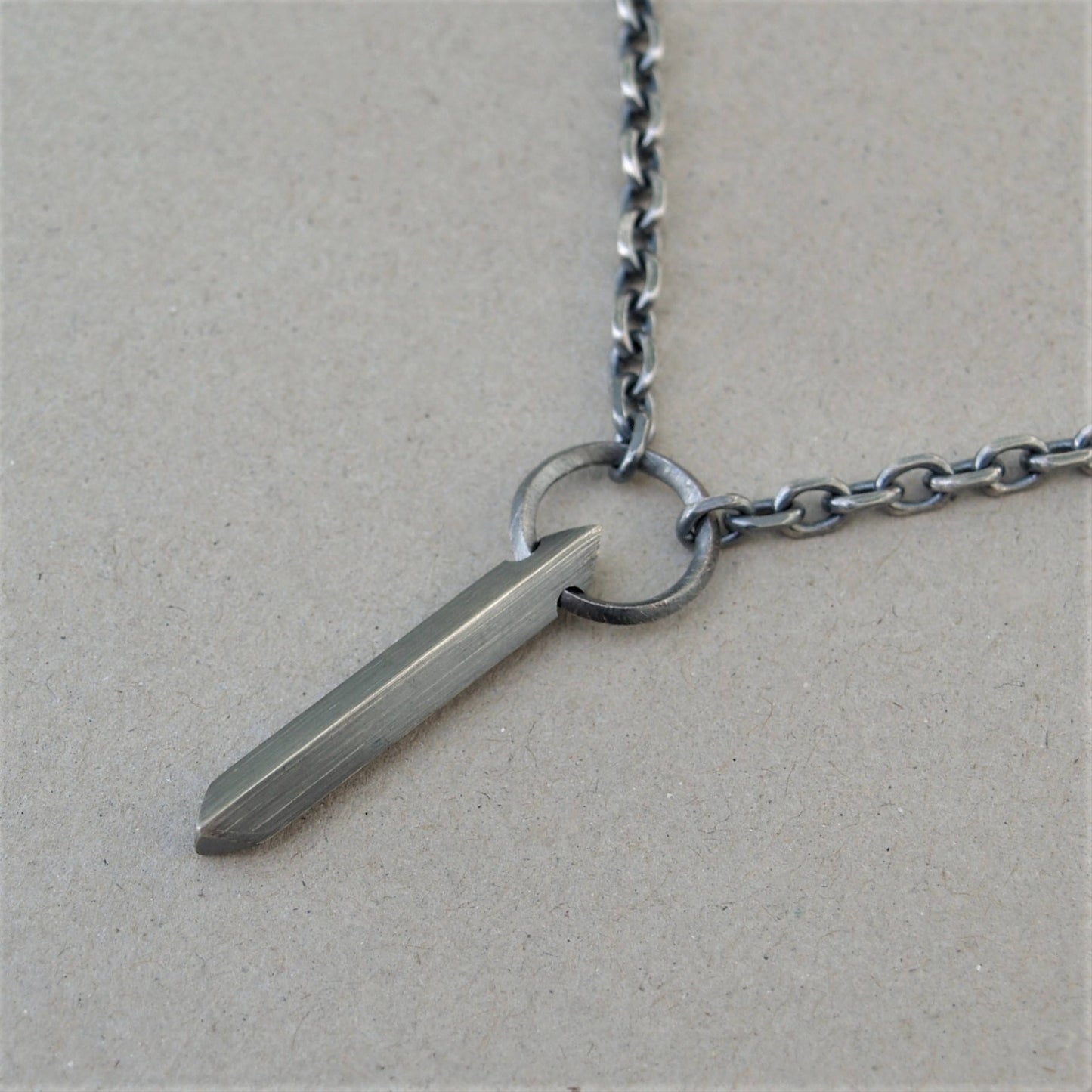 Oxidised or polished solid sterling silver large amulet pendant and loop detail on a diamond cut trace chain