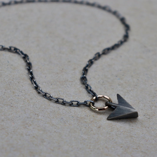 Oxidised or polished solid silver arrow pendant and 9ct yellow gold loop detail on a diamond cut trace chain