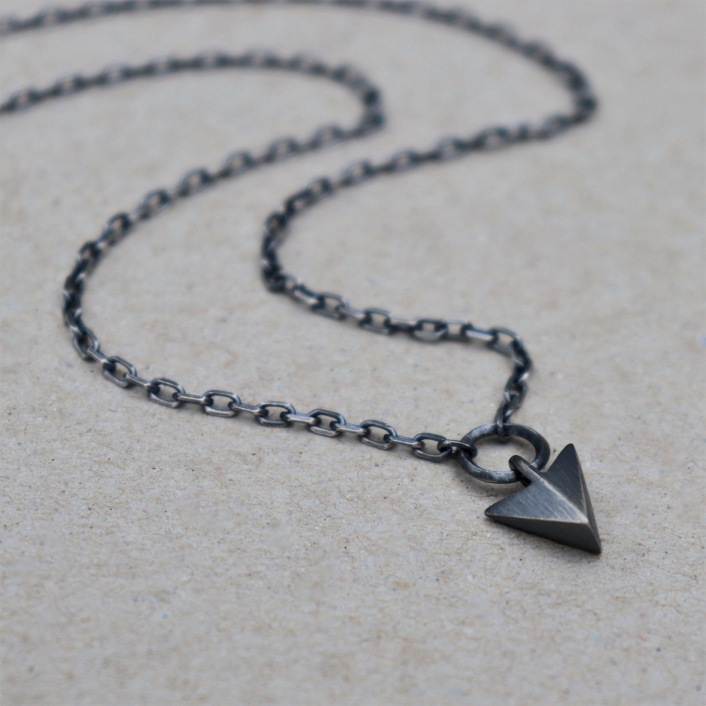 Solid silver arrow loop detail pendant on a diamond cut trace chain - Oxidised or polished