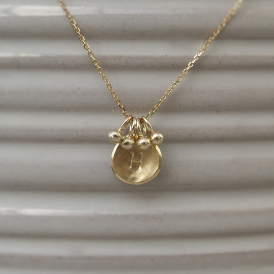 Handmade 9ct solid yellow gold small 10mm petal charm pendant with seed ball detail on a chain - Can be personalised