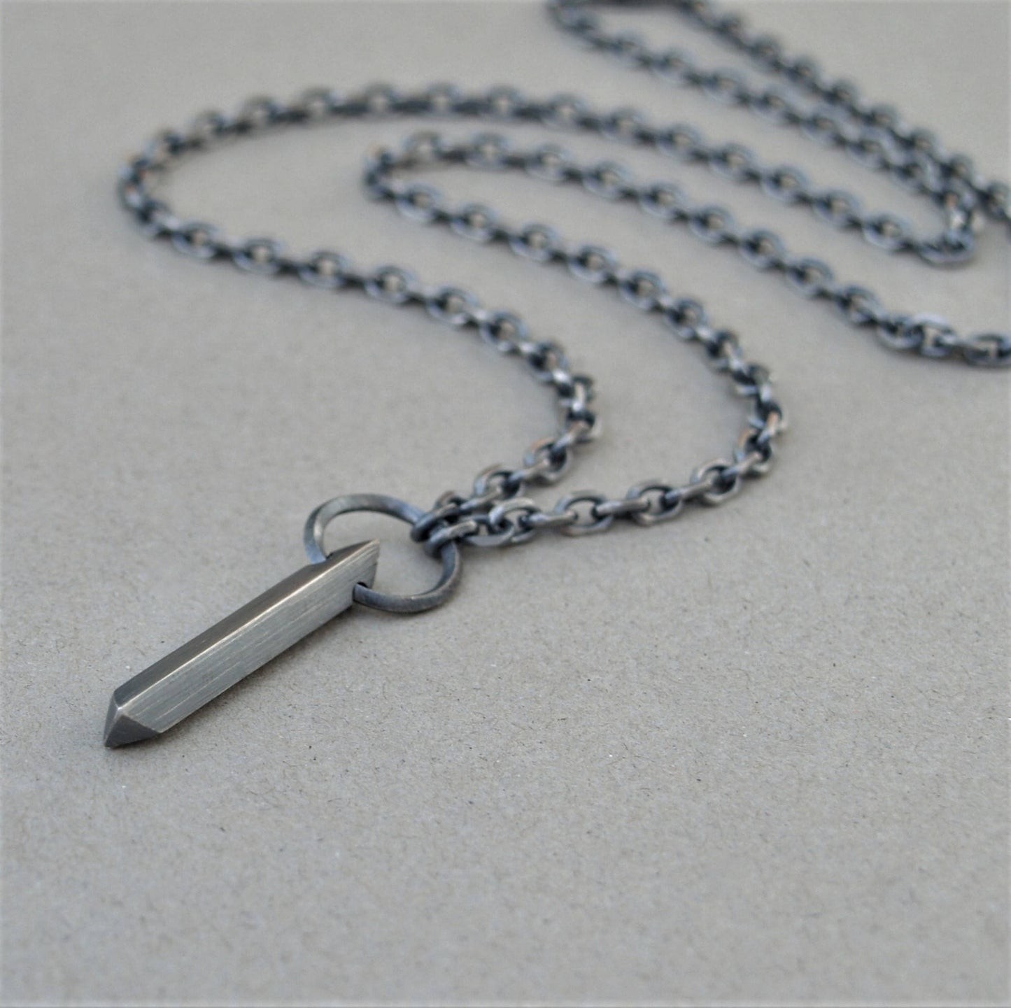 Oxidised or polished solid sterling silver large amulet pendant and loop detail on a diamond cut trace chain