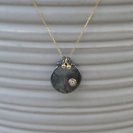 Oxidised silver and 9ct gold diamond petal pendant on a fine 9ct yellow gold chain with seed detail