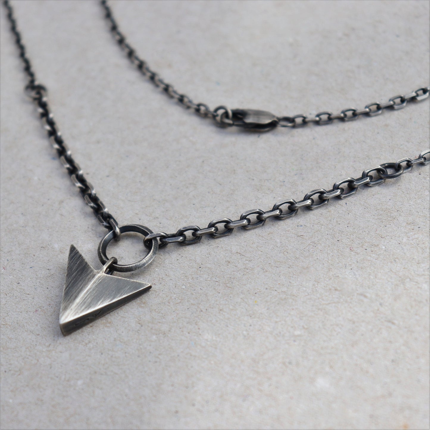Oxidised solid silver large arrow pendant on two widths of diamond cut trace chain