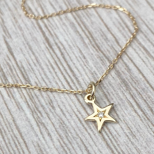 9ct solid yellow gold star engraved diamond tiny star charm pendant and chain.