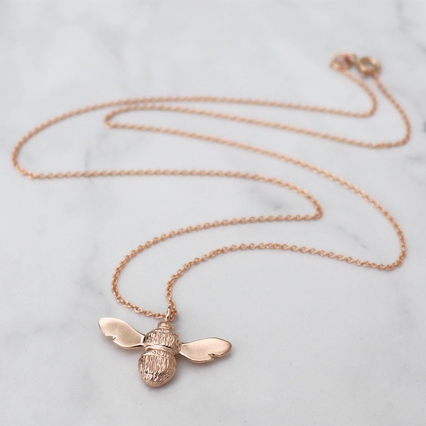 9ct solid rose gold Bumblebee pendant on a 9ct rose gold trace chain