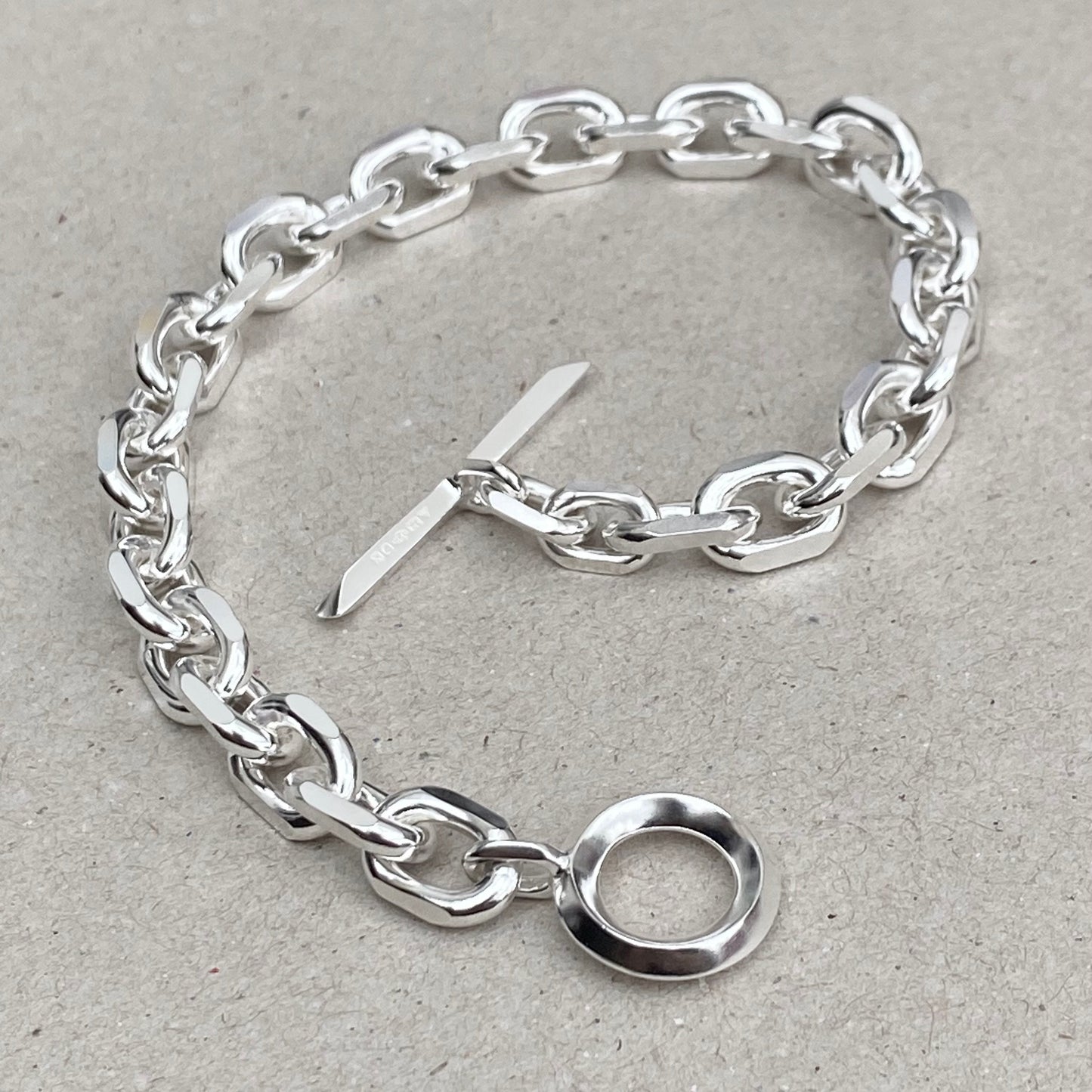 Oxidised or polished solid silver 8.5mm wide diamond cut trace chain bracelet with a unique T-bar design