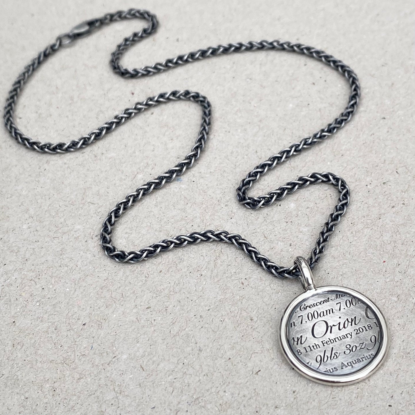 Handmade oxidised or polished solid silver round framed birth story pendant on a spiga chain - Mens jewellery