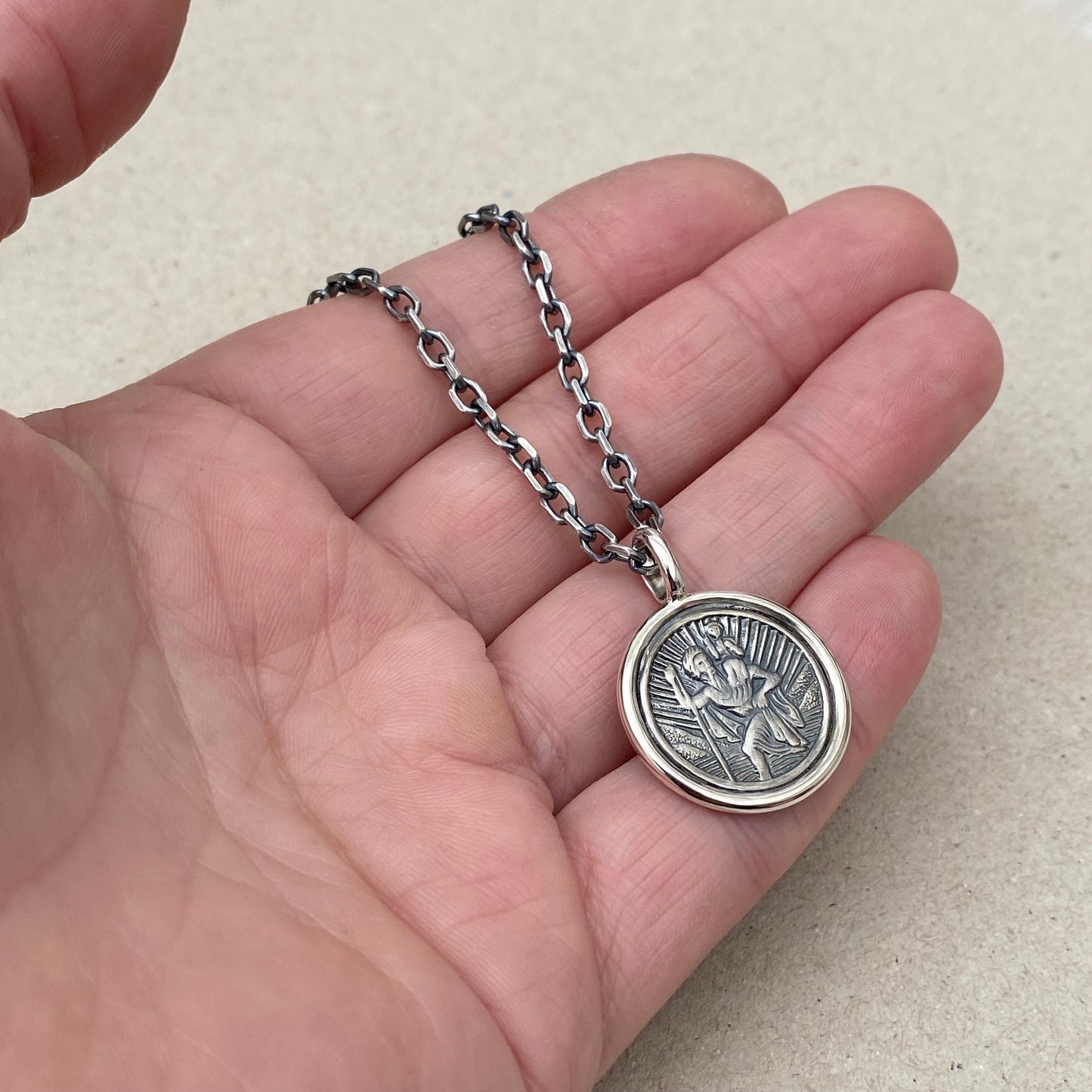 Oxidised solid silver Saint Christopher circle framed pendant on a 3mm wide diamond cut trace chain