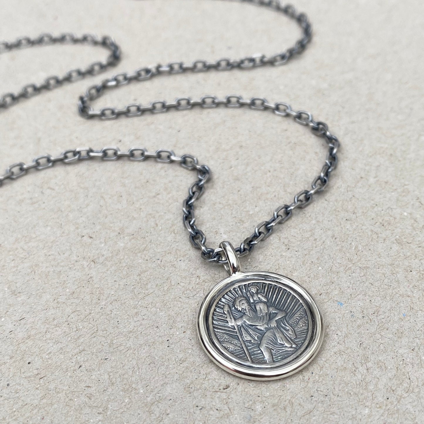 Oxidised solid silver Saint Christopher circle framed pendant on a 3mm wide diamond cut trace chain