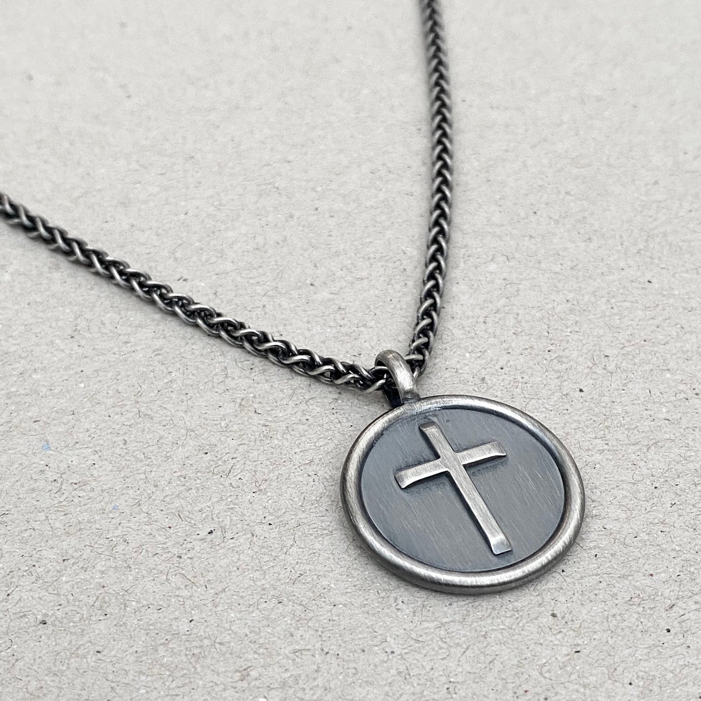 Oxidised solid sterling silver framed circle cross pendant on a spiga chain