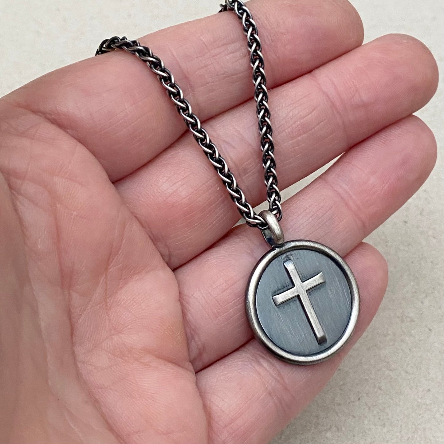 Oxidised solid sterling silver framed circle cross pendant on a spiga chain