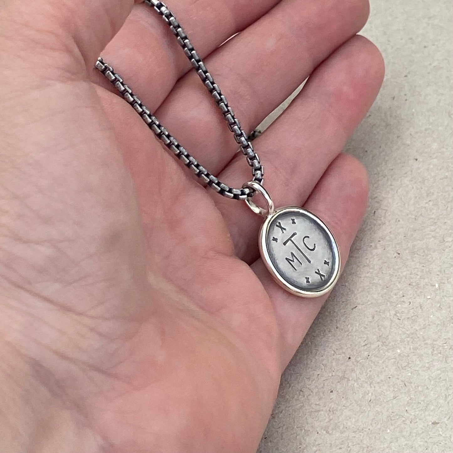 Handmade oxidised solid sterling silver round framed initial pendant on a round box belcher chain