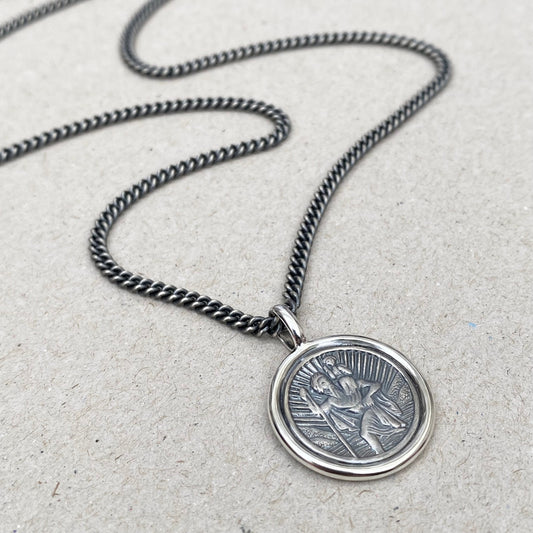 Oxidised solid silver Saint Christopher circle framed pendant on a close curb chain