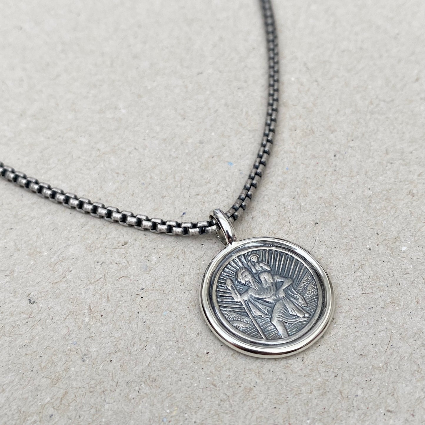 Oxidised solid silver Saint Christopher framed circle pendant on a 2.5mm wide round box belcher chain