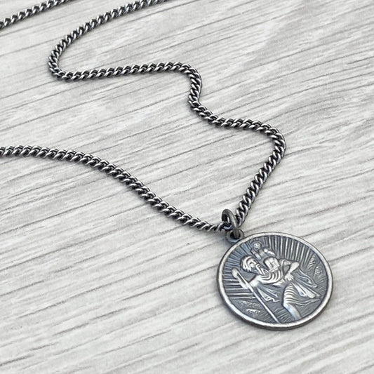 Oxidised or polished solid silver round Saint Christopher pendant on a curb chain