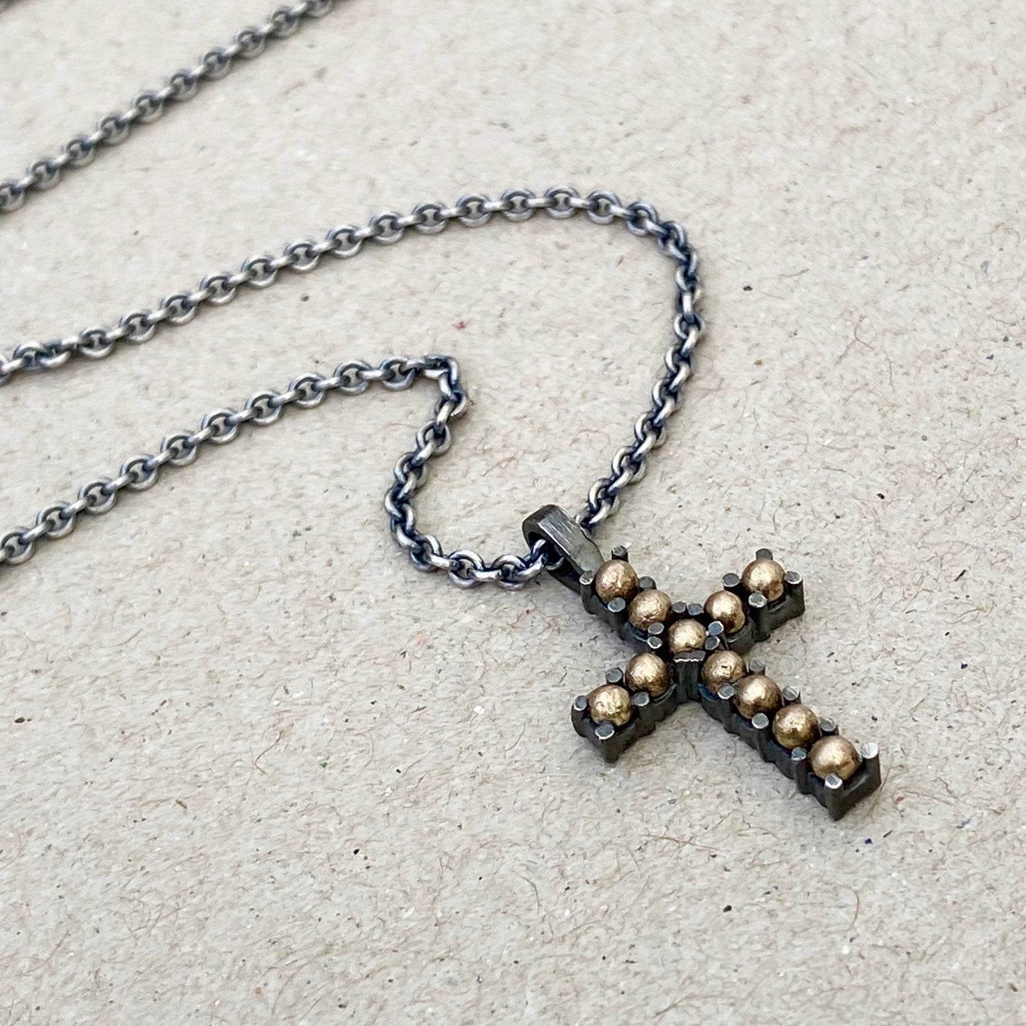 Oxidised sterling silver and 9ct yellow gold ball detail cross pendant on a 1.9mm close trace chain