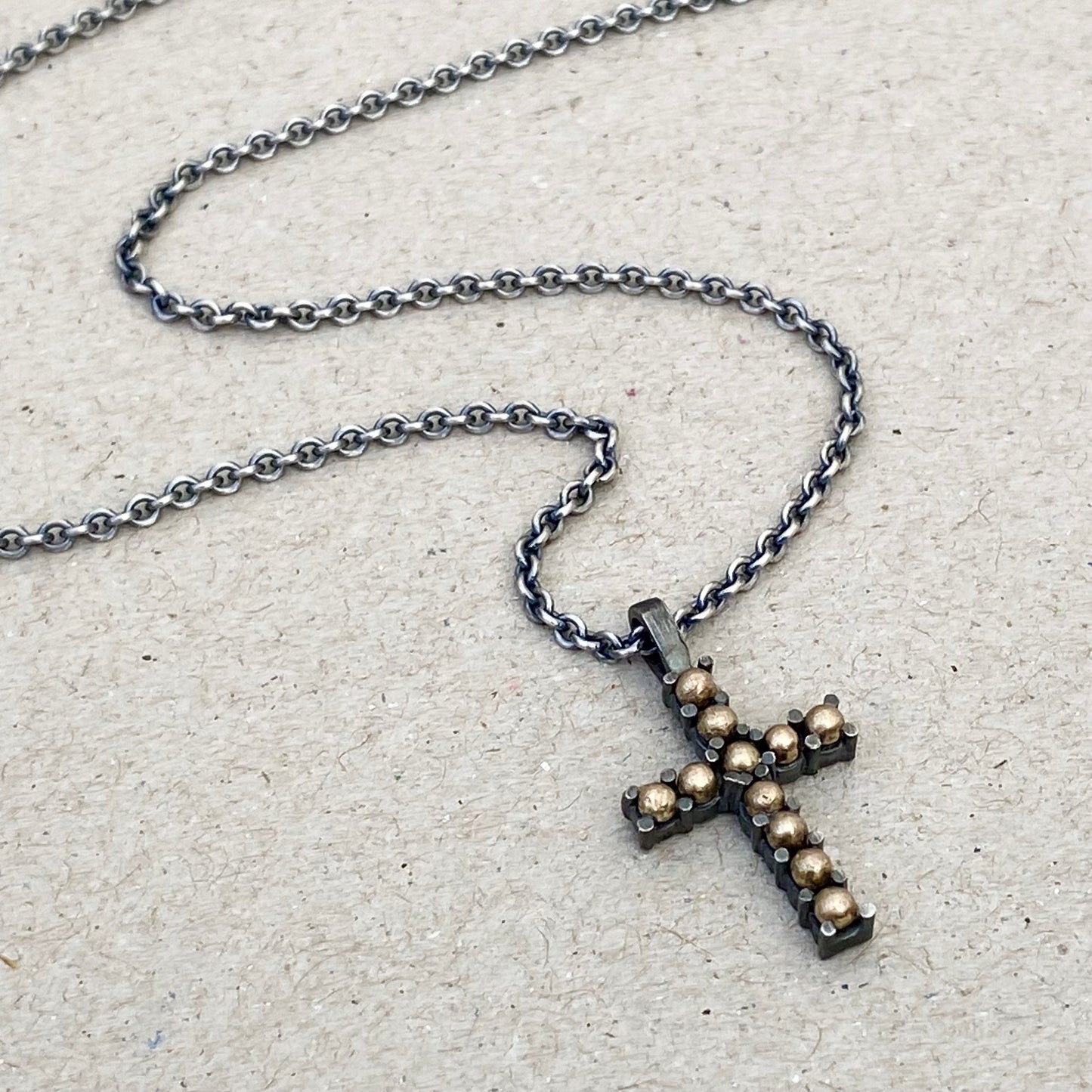Oxidised sterling silver and 9ct yellow gold ball detail cross pendant on a 1.9mm close trace chain