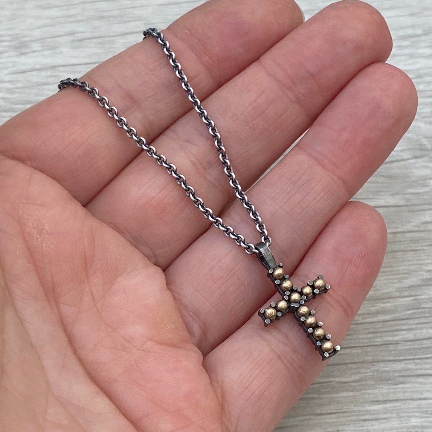 Oxidised sterling silver and 9ct yellow gold ball detail cross pendant on a 1.9mm close trace chain
